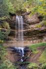 USA, Michigan, Hiawatha National Forest. Landscape with Munising Falls and sandstone cliff. Art Print